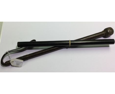 A leather covered riding crop with weighted end and strap. Overall length 46cm. Together with an Ebony measuring stick 382mm 