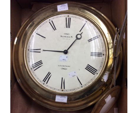 A late 19th Century wall clock with pendulum, Sewells of Liverpool, brass surround, diameter of face and surround 40 cms, 16 