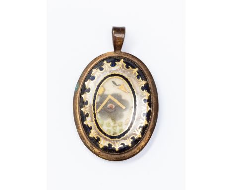 A 19th Century Masonic pendant, oval form with gilt metal with enamel details, size approx 35 mm x 28 mm, 