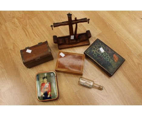 A nautical themed collectors lot to include an HMS Victory pipe rack, a ship in a bottle and assorted tins and boxes