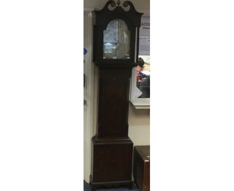 An early 19th century oak cased 30 hour longcase clock, hood with a swan neck pediment and brass finial, white enamel with Ar