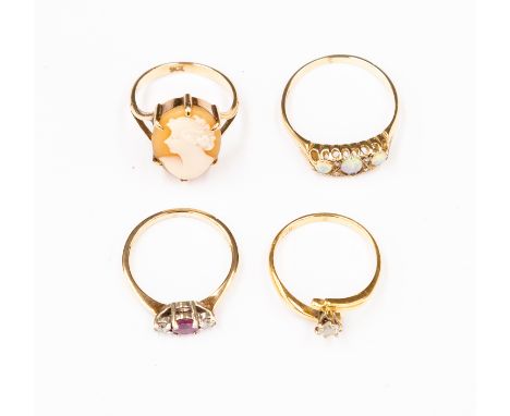 A collection of four rings including a diamond solitaire set in 18ct gold, size N1/2, total gross weight approx 2.5 gms; a ru