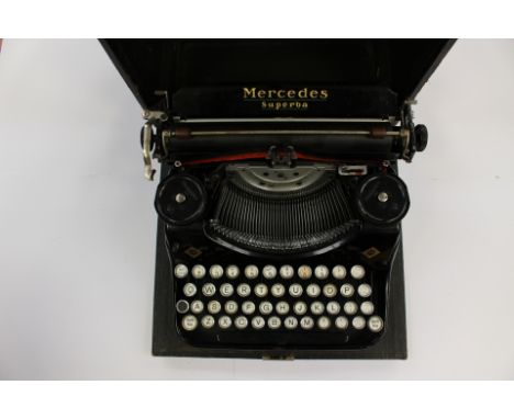 A cased 1930's Mercedes Superba portable typewriter