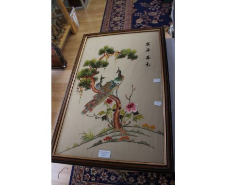 A Chinese embroidery with four symbols, peacocks in a fir tree with peonies at ground level, probably 1930's