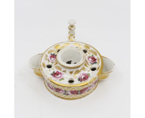 A Derby porcelain inkwell painted with rose and trellis pattern, red crown mark with painted red number 24, 15 cms diameter