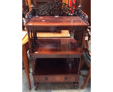 A Victorian three tier mahogany whatnot with carved fretwork.to top tier surround and one drawer to base