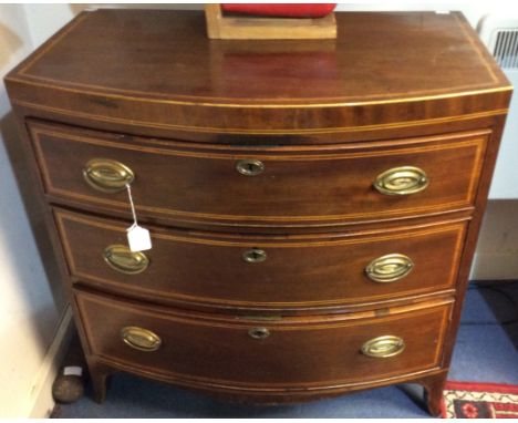 A George III mahogany bow fronted chest of drawers, fitted with three graduated drawers, retaining original handles, bracket 