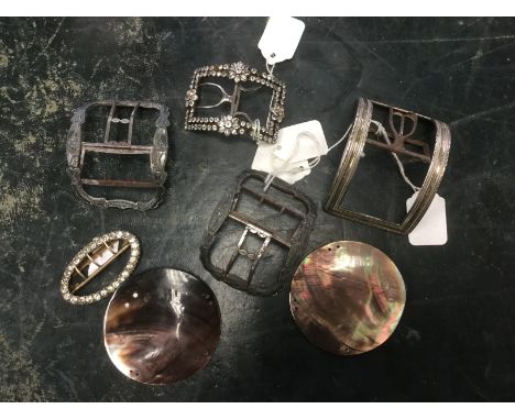 A Regency silver and steel shoe buckle, also a pair of steel and white metal buckles, a steel and diamante buckle, a white me