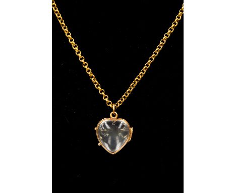 A heart shaped double sided locket, glass with a yellow metal surround,  approx 18 mm, on a gilt and chain