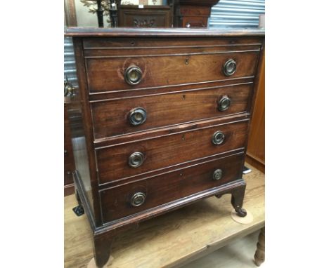 A Georgian commode in the form of a chest.