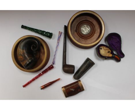 A horn snuff mull; cheroot/cigarette holders, pipe; wine coasters