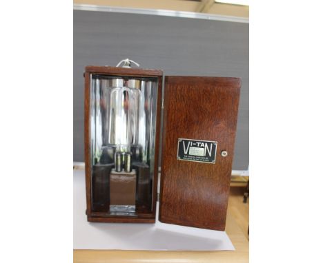 Medical; an oak cased 1920's ultra violet lamp for skin and other light treatments, all complete