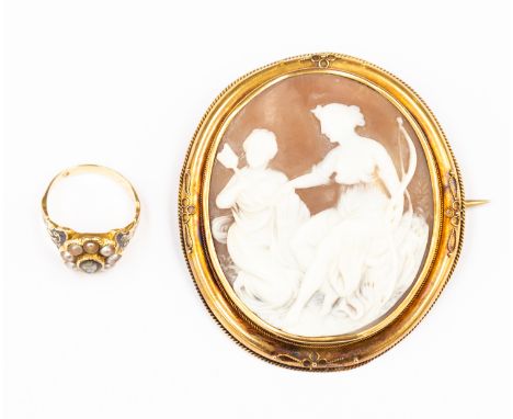A Victorian cameo brooch, unmarked yellow metal surround along with a 19th Century mourning ring, with carved cameo, seed pea