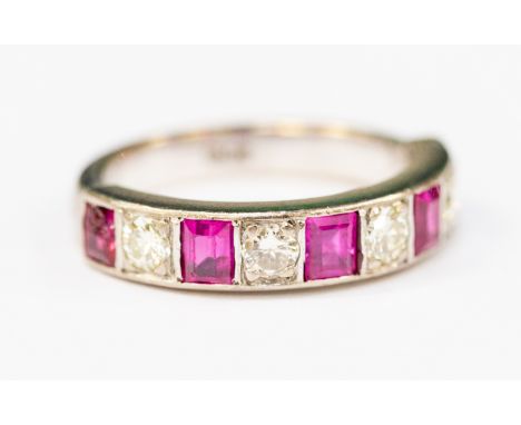 An 18ct white gold, diamond and rubies half eternity ring, alternately set with four round-brilliant cut diamonds total  weig