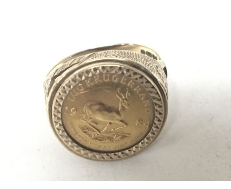 A 9carat gold ring set wit a 1/10 gold Krugerrand coin weight 7.4g