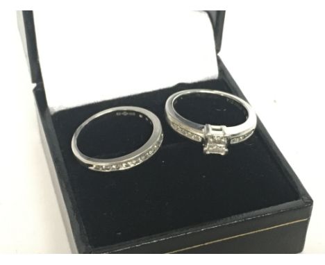 A set of platinum and diamond engagement and eternity rings, size K. 7.7g. Postage cat A
