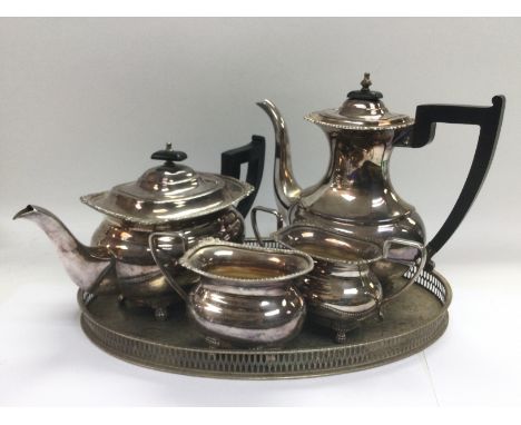 A silver plated gallery tray and a four piece silver plated tea service (5). NO RESERVE
