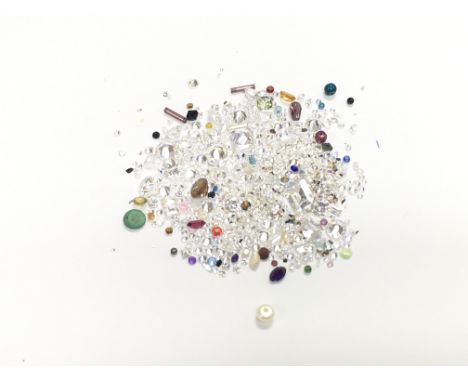 A collection of mixed unmounted gemstones including ruby - garnet etc. approximately 119ct total. Postage A