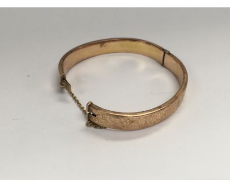A 9ct gold bangle. Approx 19.5grams.