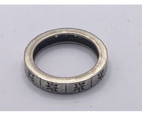 An 18carat gold eternity ring set with small chip diamonds weight 4.5g