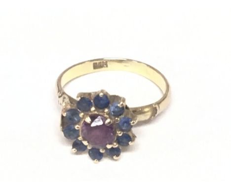 An 18carat gold ring set with a ruby flanked by sapphire shank A/F. Ring size K.