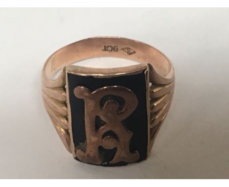 A gents 9carat rose gold ring with applied gold initials weight 5g