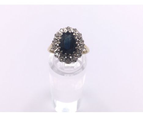 18ct gold diamond &amp; sapphire cluster ring. Approx 4.9g. Ring size O. Postage category A.