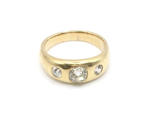 An 18ct 3 diamond gypsy ring. Size O and 8g. Centre stone is approximately 0.5ct. Postage B.