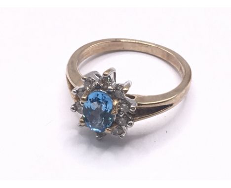 9ct yellow gold diamond &amp; light blue 5 stone ring. Approx 3.6g. Ring size M/N. Postage category A.