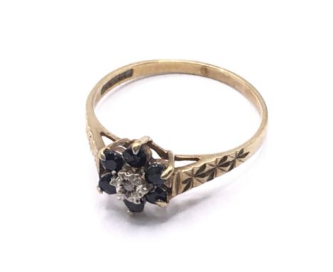 9ct gold diamond &amp; sapphire cluster ring. Approx 1.2g. Ring size K. Postage category A.