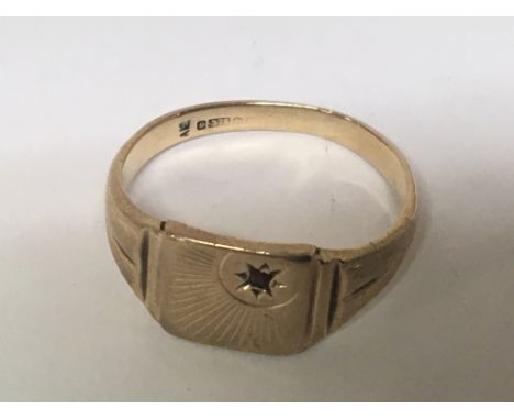 A 9carat gents ring set with a chip stone ruby Weight 6g