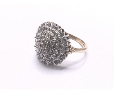 9ct yellow gold diamond cluster ring. Approx 4.1g. Ring size H. Postage category A.