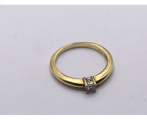 An 18carat gold ring set with a small princess cut diamond. Ring size L. Weight 2.5g