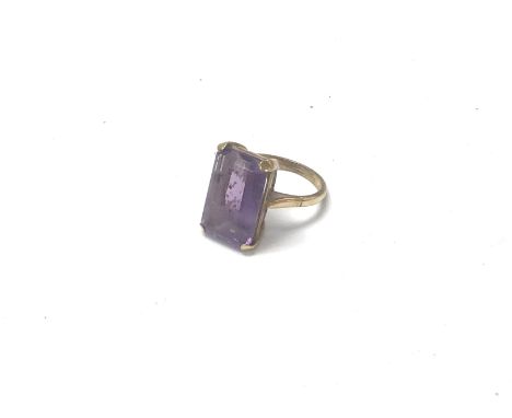 A 9ct gold ring set with a large amethyst, approx 5.72. Ring size O 1/2.
