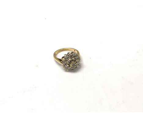 An 18ct gold cluster ring, size J. Approx 4.89, shipping category A.