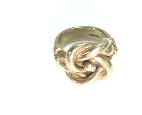 A lovely heavy 9ct gold knot ring. Size X 1/2 &amp; 28.88g.Postage B