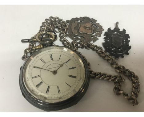 A Silver pocket watch key wind Centre Seconds Chronograph with attached chain and silver fobs. Not seen working.