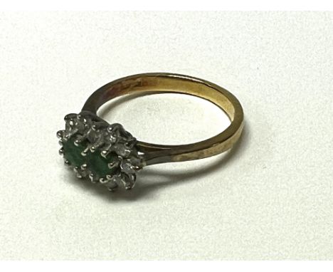 An 8ct yellow gold emerald and diamond cluster ring, Size J (A).