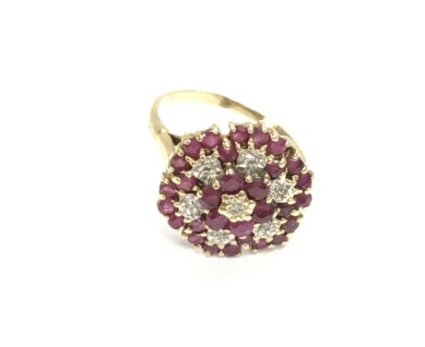 An unmarked ruby and diamond ring. Size L and 3.58g. Postage B