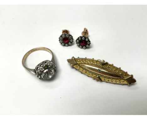 Group lot. A yellow metal Edwardian style brooch, a pair of gold and seed Pearl stud earrings, a 9ct gold and silver stone se