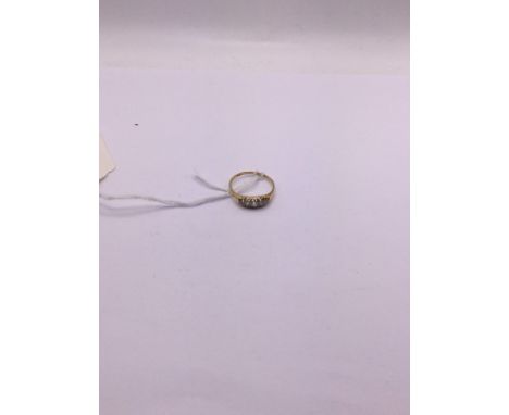 An 18ct gold ring with a row of diamonds, approx 2.36grams. Shipping category A