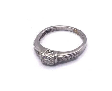 9ct white gold CZ ring. Approx 2.1g. Ring size I. Postage category A.