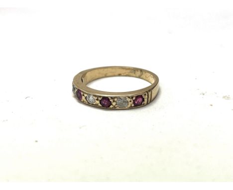 A 9ct yellow gold ruby and diamond set ring. Size M, approx 2.4 grams.