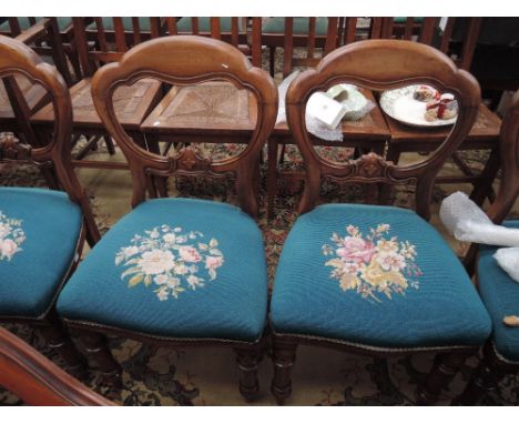 A set of five Victorian mahogany dining chairs having scroll backs with later turquoise tapestry seats