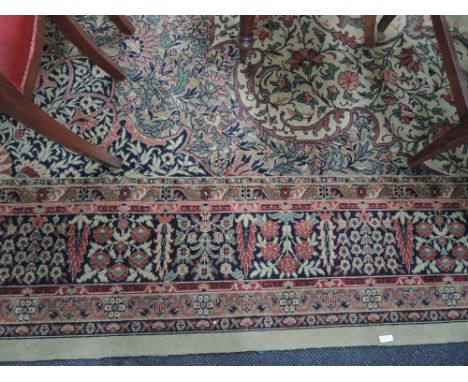 A mid 20th century carpet square of Wilton design having floral pattern on cream ground