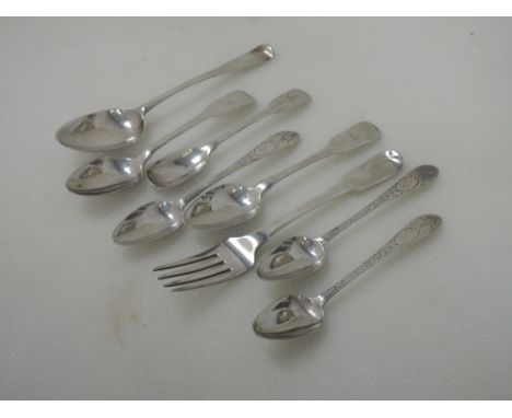 Seven Irish silver spoons and a fork, including three teaspoons having brightcut decoration, two having fiddle pattern, a mus
