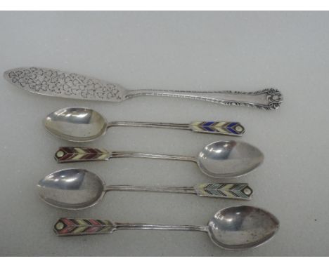 Four silver teaspoons having enamelled arrow style terminals, Birmingham 1957/58, Turner & Simpson, and a silver butter knife