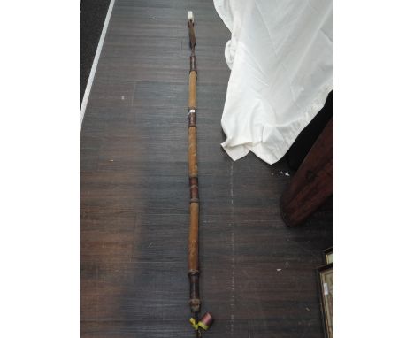 A tribal hunting spear having skin shaft and metal blade possibly African Masi design