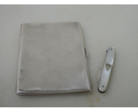 A silver cigarette case having gilt interior and engine turned decoration, London 1935, TWL, and a folding fruit knife having