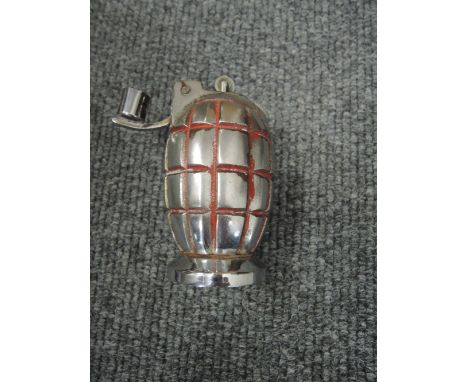 A Mills Bomb hand grenade converted to desk lighter